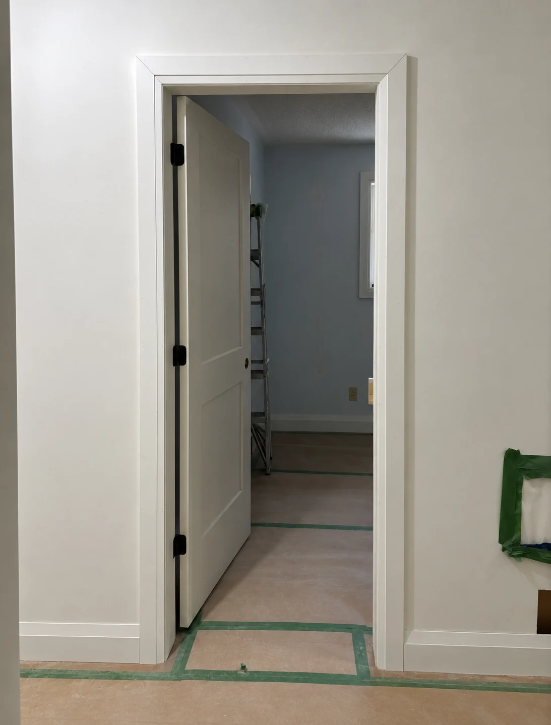 Installed white door casing with precise mitred corners